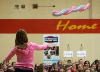 Kids volunteer in the Mousetrap Machine Science Assembly