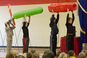 Kids volunteer in the Mousetrap Machine Science Assembly