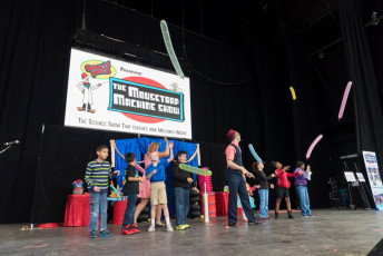 Kids volunteer in the Mousetrap Machine Science Assembly