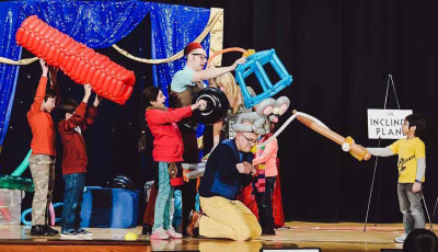 Kids volunteer in the Mousetrap Machine Science Assembly