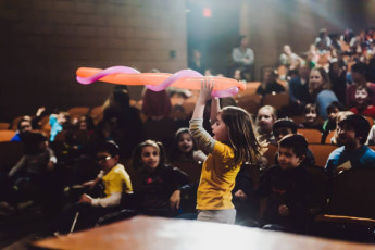 Kids volunteer in the Mousetrap Machine Science Assembly