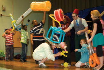 Kids volunteer in the Mousetrap Machine Science Assembly