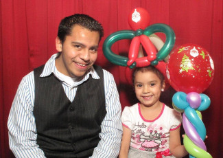 Families enjoy the Smarty Pants Balloon Art for Holiday Party
