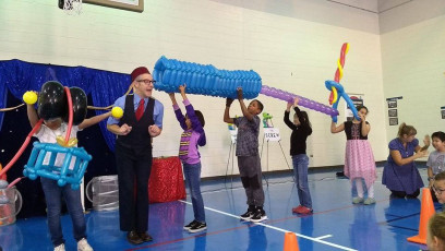 Kids volunteer in the Mousetrap Machine Science Assembly