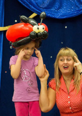 A Lovely Lady Bug Balloon helps with the show!