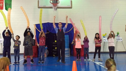 Kids volunteer in the Mousetrap Machine Science Assembly