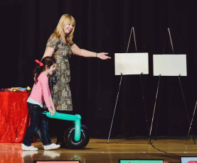 Kids volunteer in the Mousetrap Machine Science Assembly