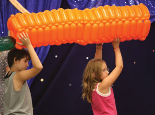 Kids volunteer during the Mousetrap Machine Science Assembly program!