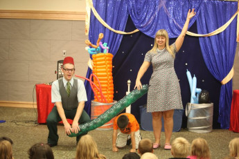 Kids volunteer in the Mousetrap Machine Science Assembly