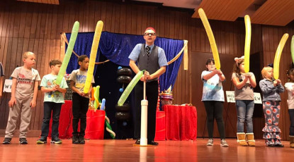 Kids volunteer in the Mousetrap Machine Science Assembly