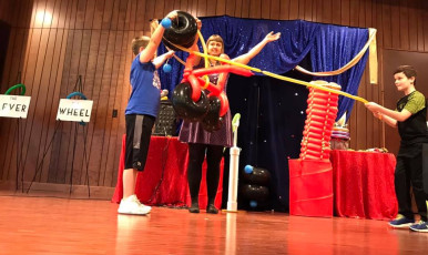 Kids volunteer in the Mousetrap Machine Science Assembly